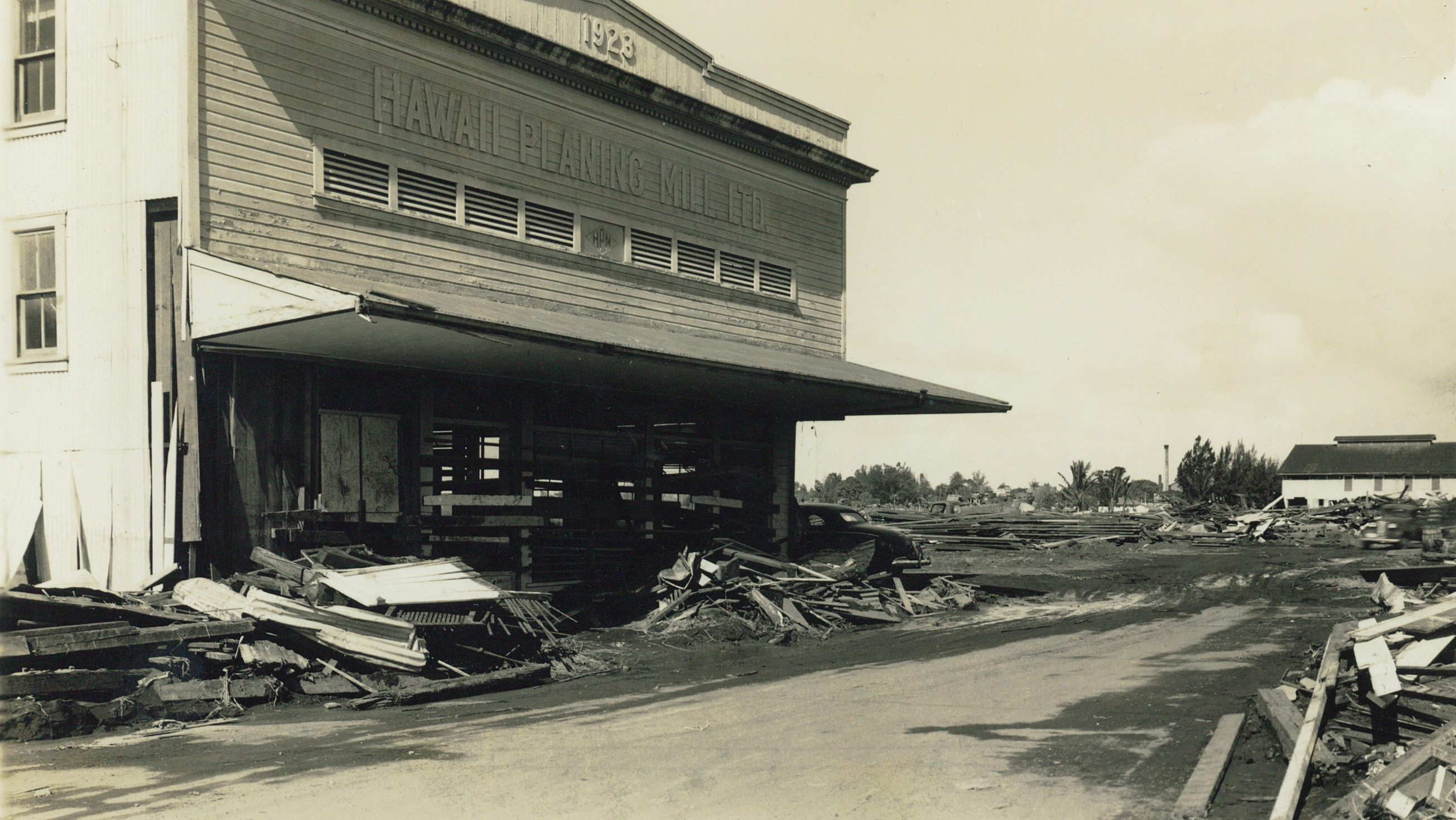 Damage to Hawaii Planing Mill was extensive but the building was still standing and the company was able to rebuild in a safer location. Photo courtesy of Hawaii Planing Mill Archives.